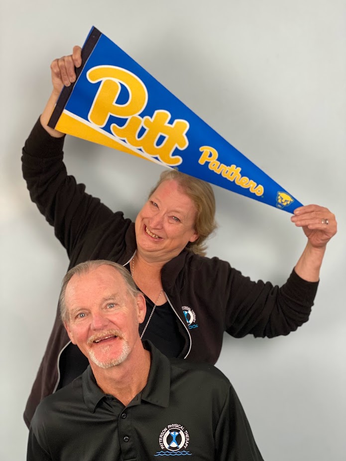 Mike and Beth Patterson with a Pitt University pennant